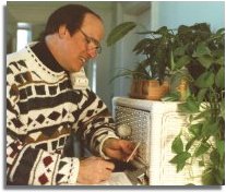 Henry Mitchell with phone and order form in hand